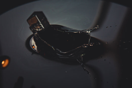 black and brown glass bottle