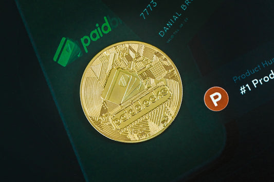 a close up of a gold coin on a cell phone