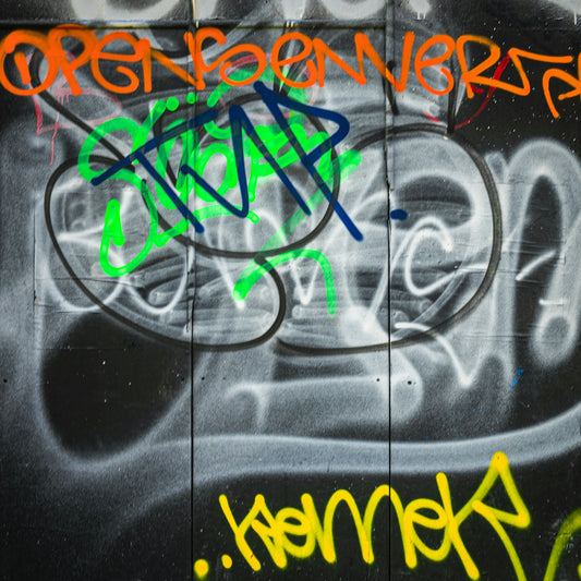 a wall with some graffiti on it