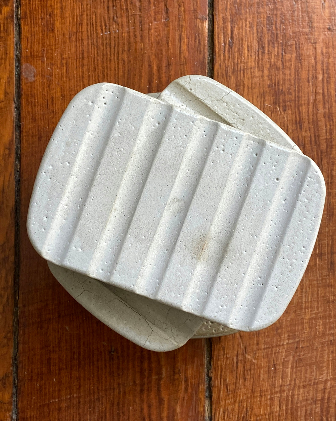 a white piece of paper on a wooden surface