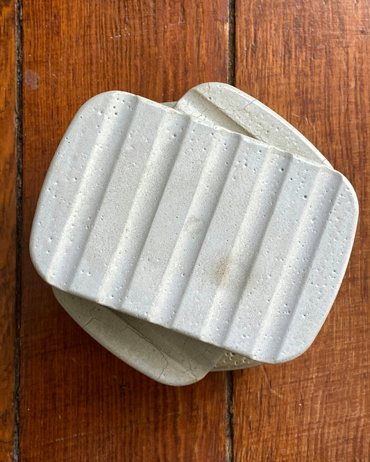 a white piece of paper on a wooden surface