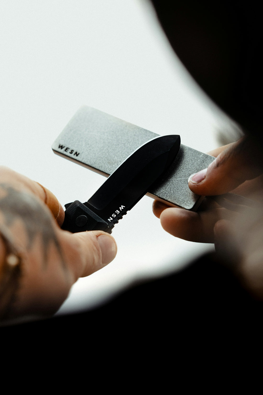 a person holding a knife in their hand