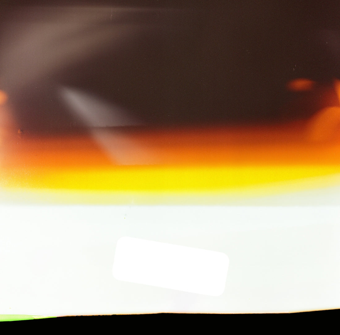 a close up of a piece of paper with a red, yellow, and green