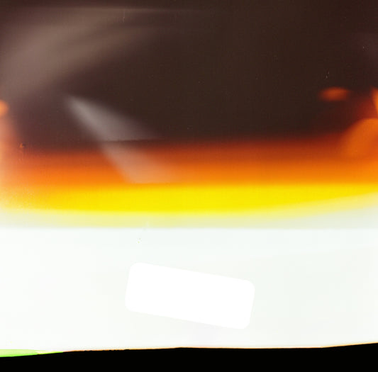 a close up of a piece of paper with a red, yellow, and green