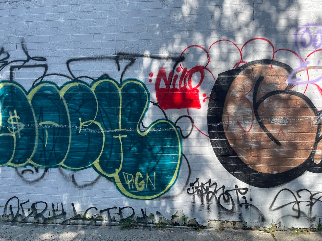 a wall with some graffiti on it