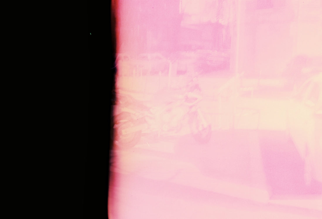 a blurry photo of a person walking down a street