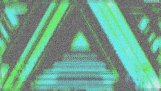 A blurry image of a building with a green triangle