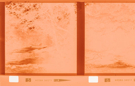 Two frames of vintage film with orange tint
